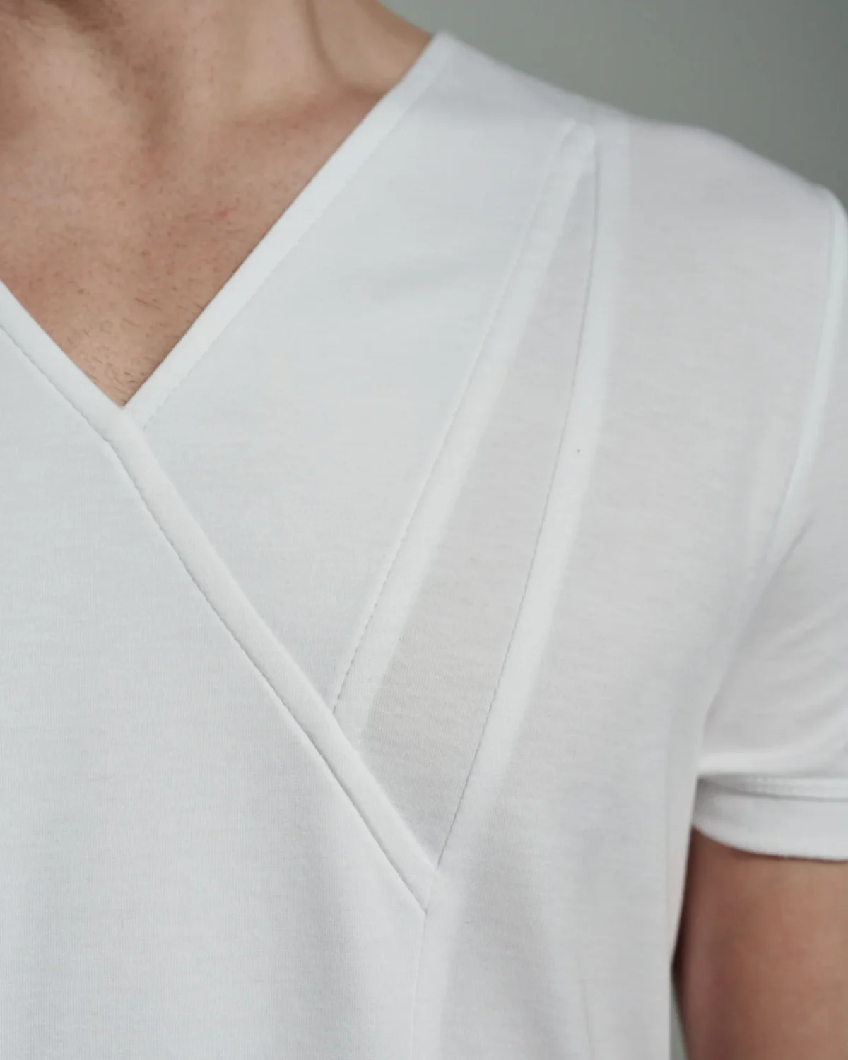 Bib Fronted V-neck with Panelled Shapes